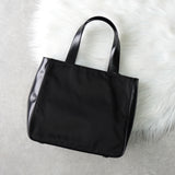 プラダ ナイロン / レザー ハンドバッグ トライアングルロゴ ブラック