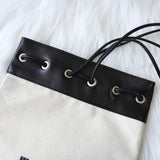 ジルサンダー ドローストリング キャンバス レザー 巾着型 ショルダーバッグ ポシェット アイボリー / ブラック 新品未使用 - NEWSED