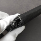 プラダ サフィアーノ レザー コインケース 三角プレート ラウンドジップ ブラック - NEWSED