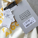 メゾンマルジェラ エイズT Vネック Tシャツ 半袖トップス イエロー タグ付き未使用品 - NEWSED