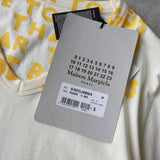 メゾン マルジェラ エイズT Vネック Tシャツ 半袖トップス イエロー タグ付き未使用品 - NEWSED