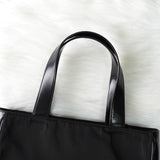 プラダ ナイロン / レザー ハンドバッグ トライアングルロゴ ブラック