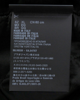 NEWSEDのPRADAシープスキンファーバケットハットの製品タグ詳細。イタリア製でサイズXLの表記が確認できる。