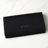 Prada nylon bifold wallet with triangle logo in black