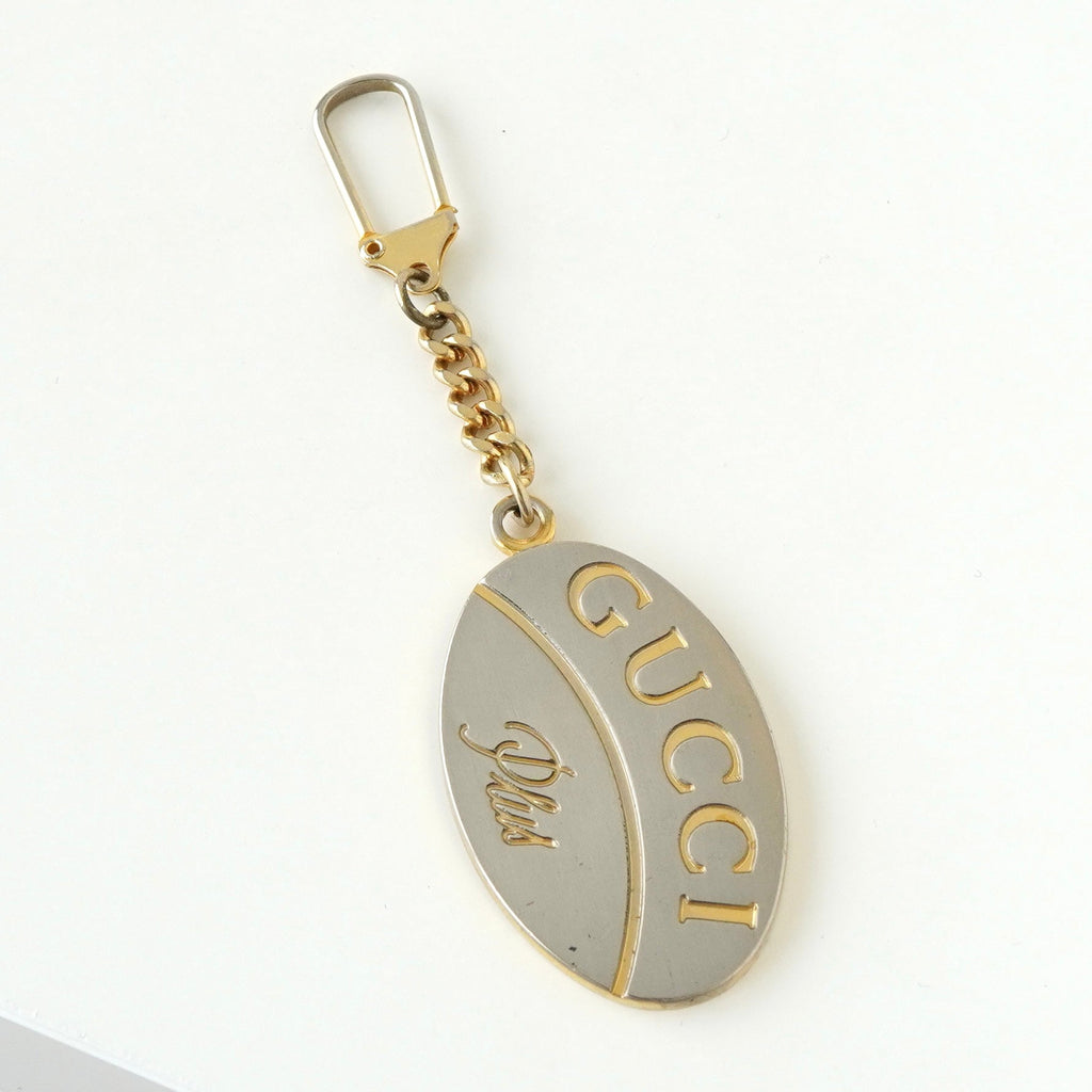 Gucci Plus 1970s-1980s Vintage Guarantee Medal Charm Strap in Silver/Gold Combination