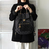 Chanel No. 2 旋锁 Matelasse 牛仔布/皮革背包（黑色）