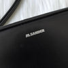 Jil Sander 黑色皮革两用单肩包/手拿包