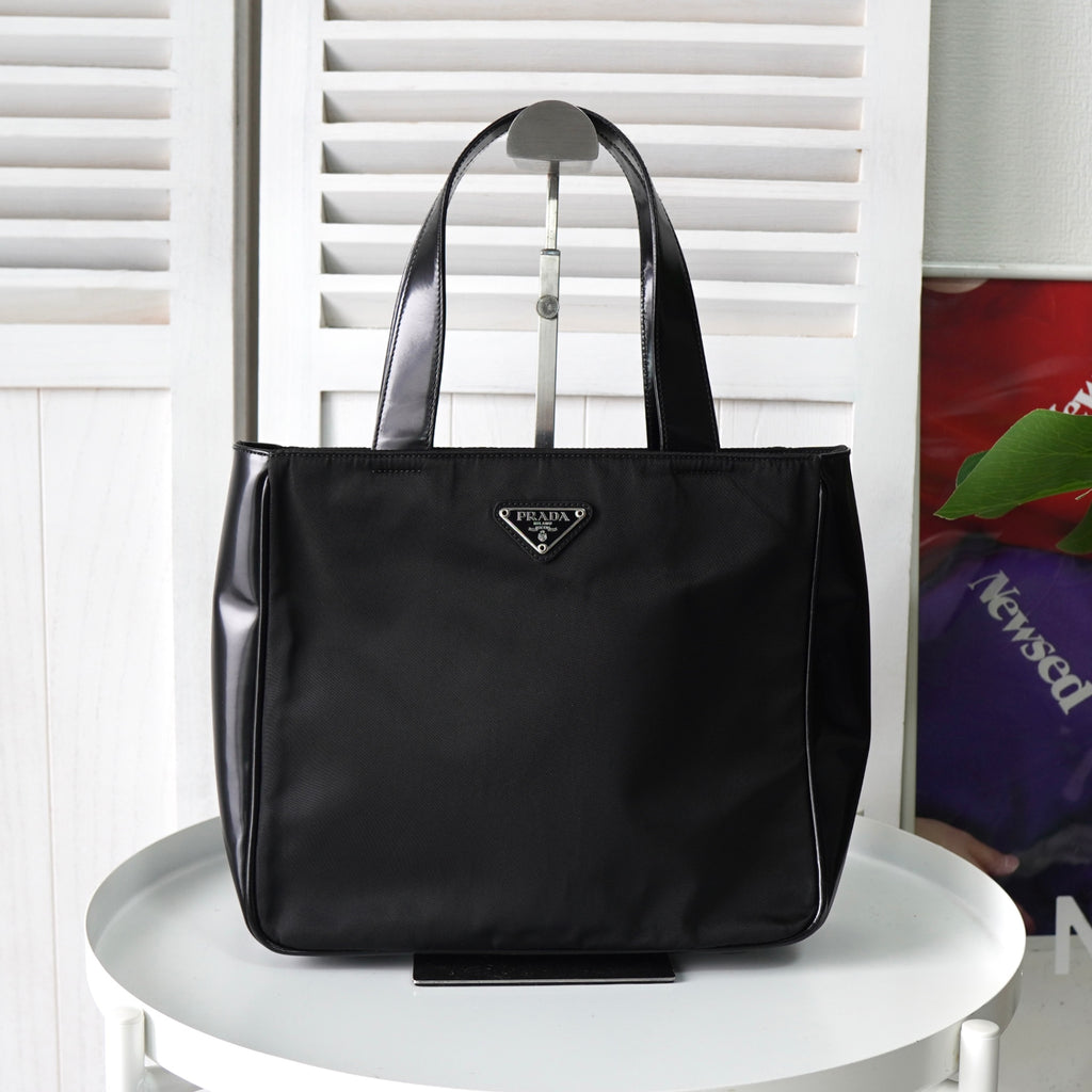 プラダ ナイロン / レザー ハンドバッグ トライアングルロゴ ブラック