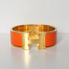 Hermes Click-Clack H PM Bangle Gold/Orange