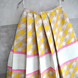 Houndstooth patterned asymmetry pleats skirt