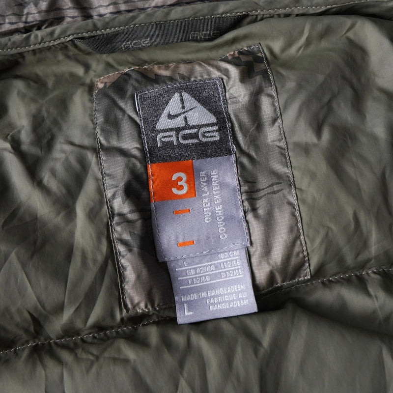 ナイキ エーシージー カモ柄 リアルツリー フーデッド ダウンジャケット カーキ - NEWSED