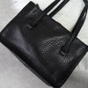 Prada 黑色/金色三角形徽标皮革扣环手提包