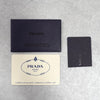 Prada 黑色/金色三角形徽标皮革扣环手提包
