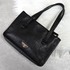 Prada 黑色/金色三角形徽标皮革扣环手提包