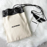 ジルサンダー ドローストリング キャンバス レザー 巾着型 ショルダーバッグ ポシェット アイボリー / ブラック タグ付き未使用 - NEWSED