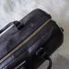 Prada Saffiano 皮革迷你波士顿包，带三角形徽标（黑色/白色）