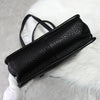 Prada 黑色/金色三角形徽标皮革扣环手提包