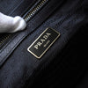 Prada Saffiano 皮革迷你波士顿包，带三角形徽标（黑色/白色）