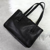 Prada 黑色/金色三角形徽标皮革扣环手提包