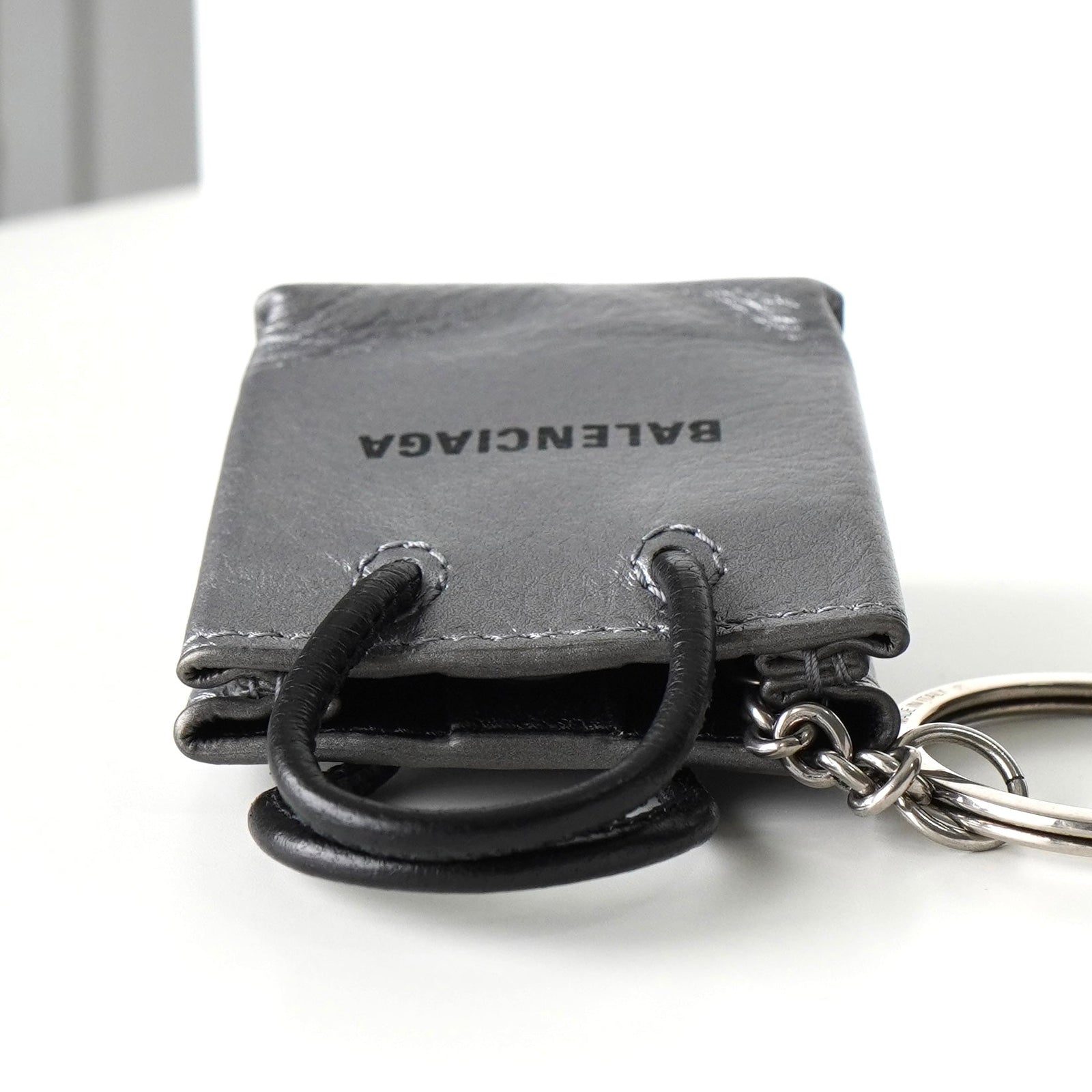 Balenciaga bag motif logo leather keychain charm in silver