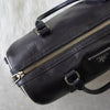 Prada Saffiano 皮革迷你波士顿包，带三角形徽标（黑色/白色）