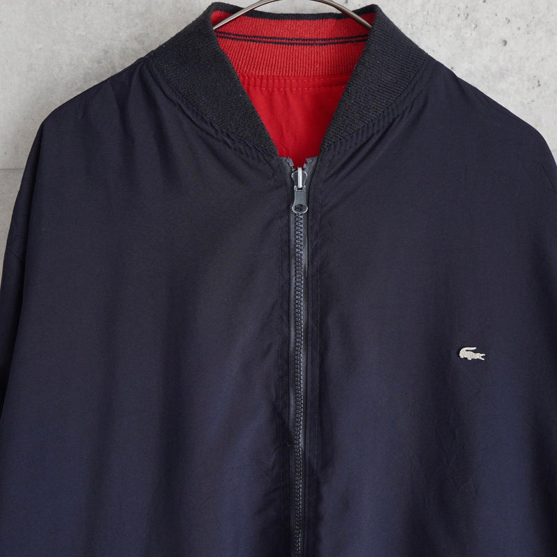 ラコステ ヴィンテージ リバーシブル スタジャン ブルゾン ロゴパッチ ダークネイビー/レッド - NEWSED
