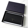 Prada nylon bifold wallet with triangle logo in black
