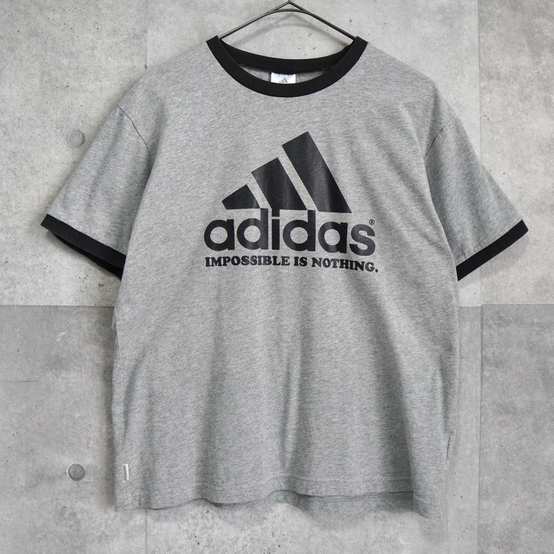 アディダス パフォーマンスロゴ リンガーTシャツ グレー / ブラック - NEWSED