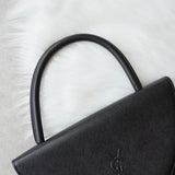 イヴサンローラン ヴィンテージ エンボス YSLロゴ レザー ハンドバッグ 自立型 ブラック - NEWSED